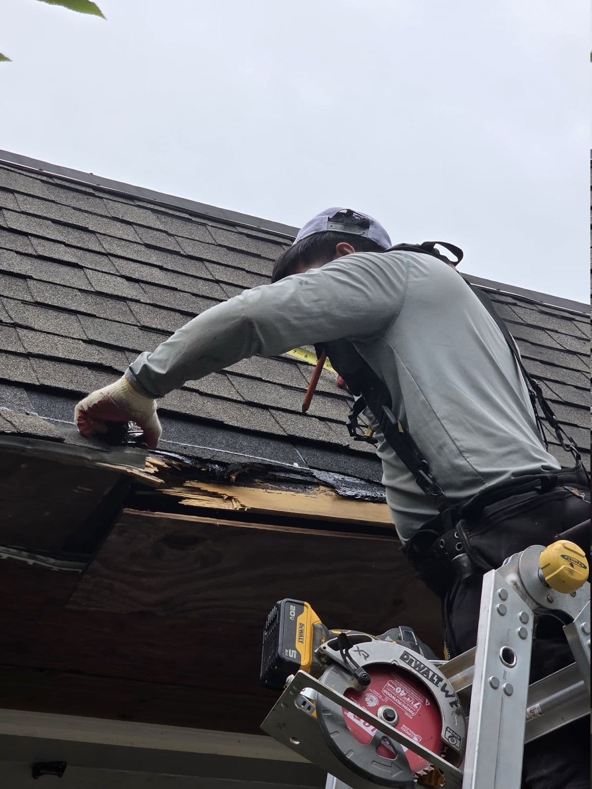 Crew member opening damaged roof-edge decking in Bethlehem