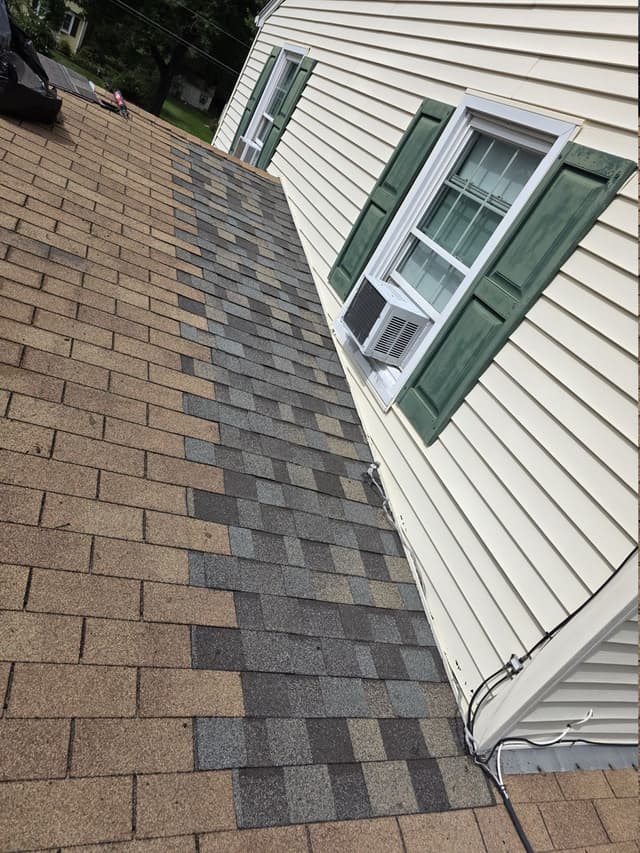 New shingle courses at the completed wall-junction repair in Suffield