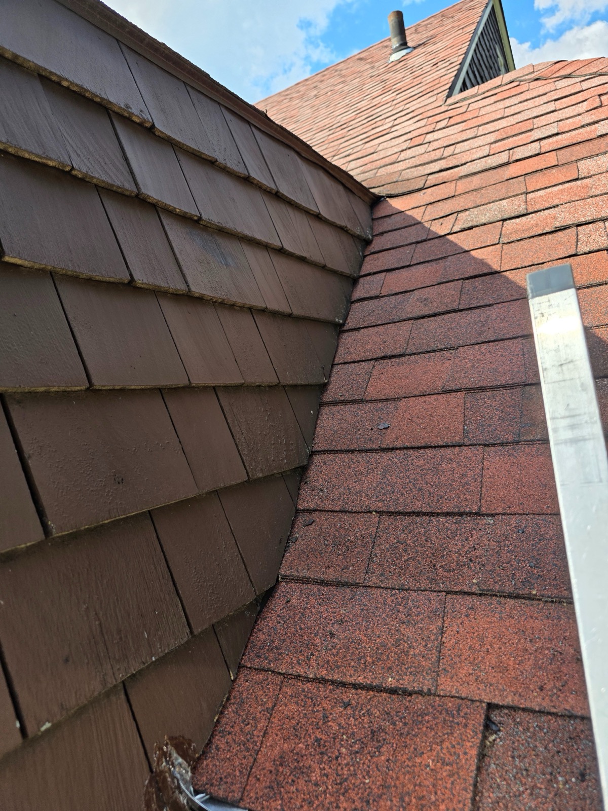 Sidewall flashing junction between shingles and shake siding on a New Britain, CT roof