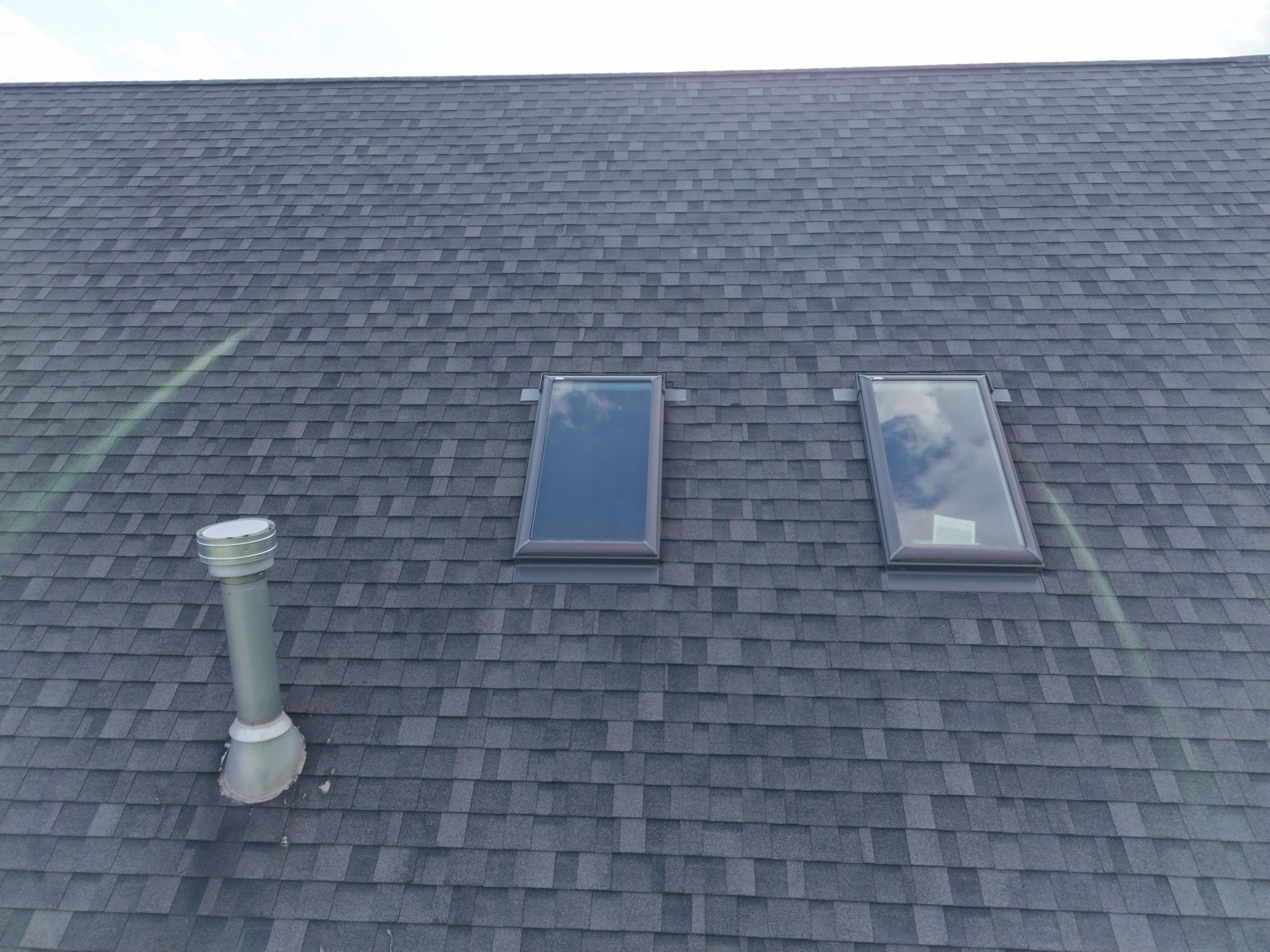Two skylights re-flashed into a new architectural shingle roof on an Avon, CT home